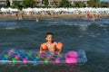 Happy family lifestyle. ÃÂ¡hildren jumping and splashing with fun in breaking waves Royalty Free Stock Photo